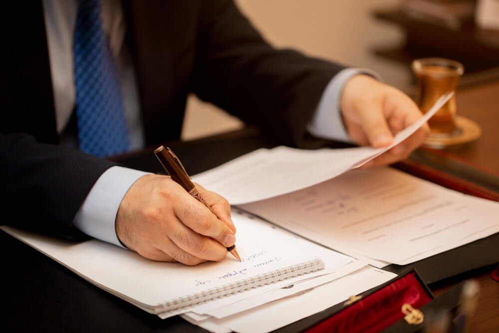 Personal Injury Lawyer writing a demand letter for a client